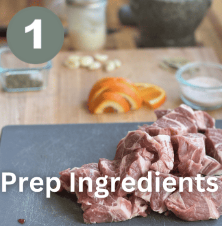 Raw pork meat and vegetables for Mexican pulled pork recipe.