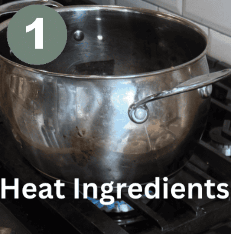 Stainless steel pot with heating ingredients for quick pickled red onions.