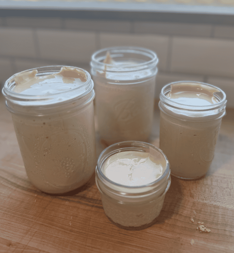 Allergy-friendly homemade marshmallow fluff in glass jars, gluten, dairy, and egg-free, with no corn.