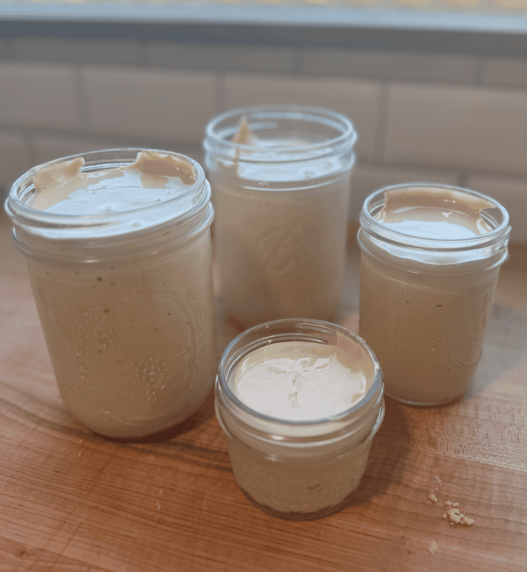 Allergy-friendly homemade marshmallow fluff in glass jars, gluten, dairy, and egg-free, with no corn.
