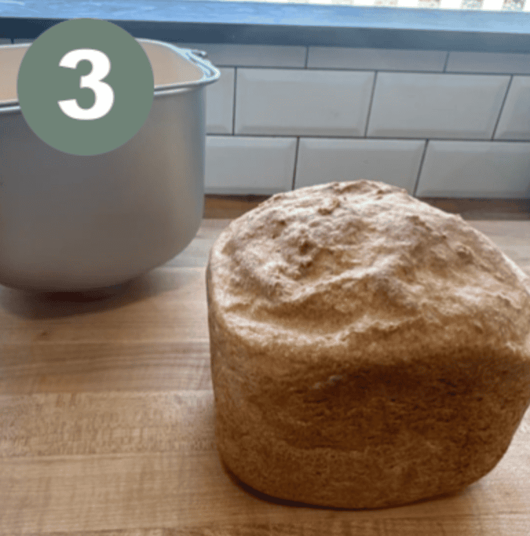 Gluten-free bread loaf in a bread machine, perfect for sandwiches and healthy eating.