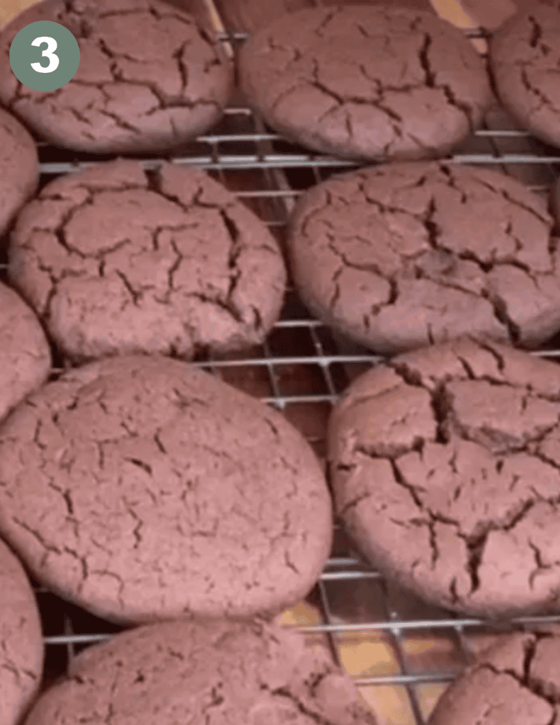 Close-up of soft gluten-free whoopie pies with cracked tops on cooling rack.