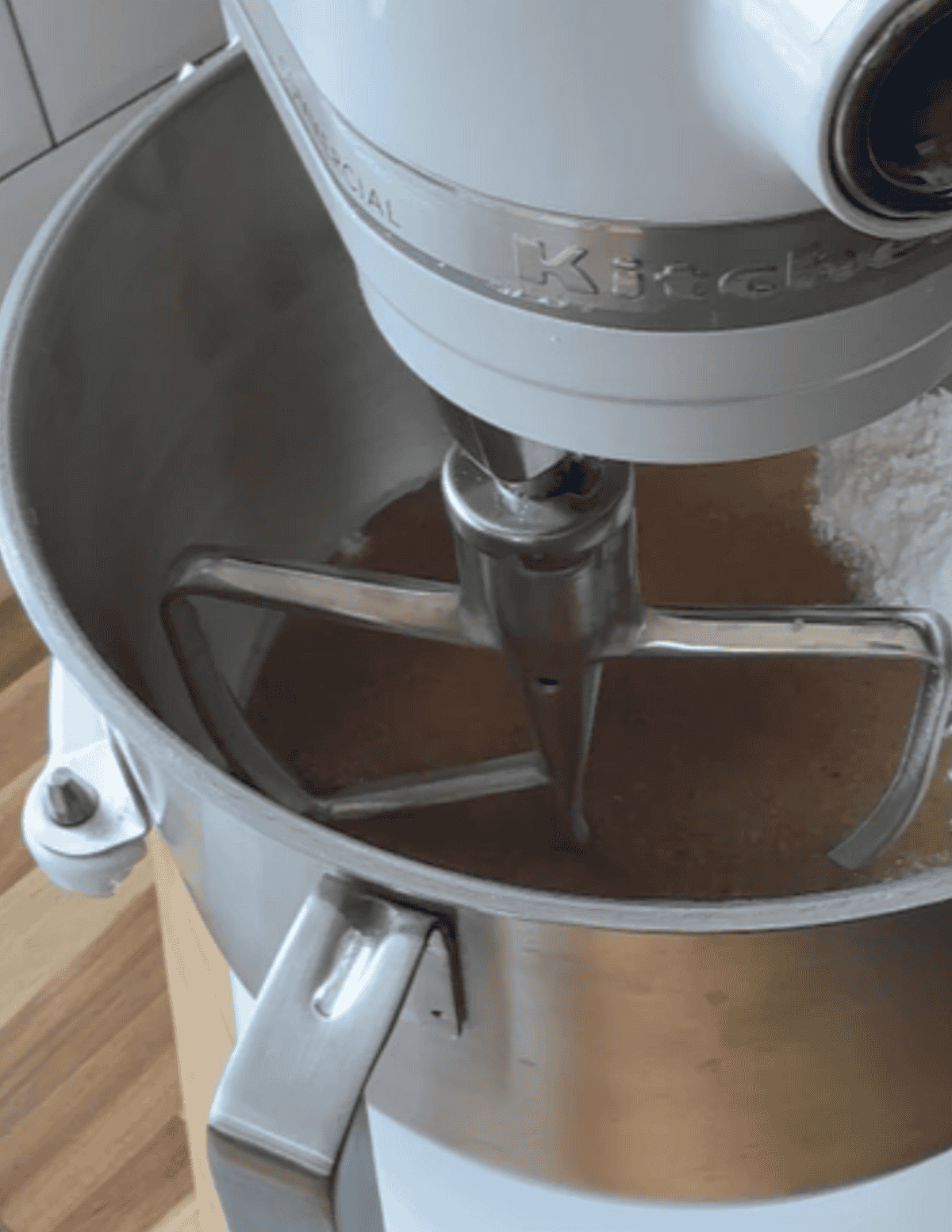 A White Mixer mixing gel in a metal bowl with a metal attachment